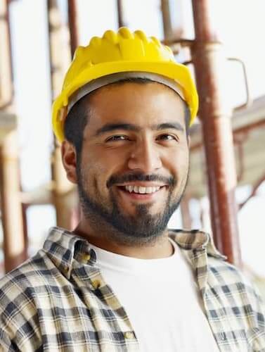 Portrait of Hispanic Construction worker hired by the construction staffing, Temp Agency